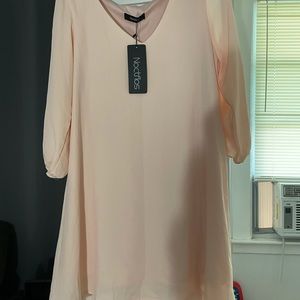 Very cute light pink light weight dress great for weddings and casual
